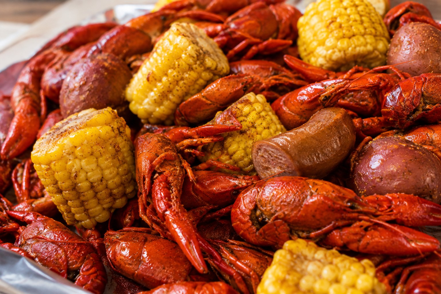 A tray of boiled Louisiana crawfish with corn, potatoes and sausage