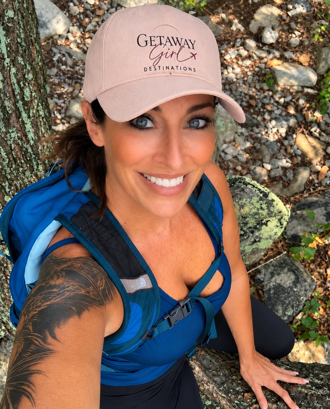 Rachel Falgout hiking in a Getaway Girl Destinations hat