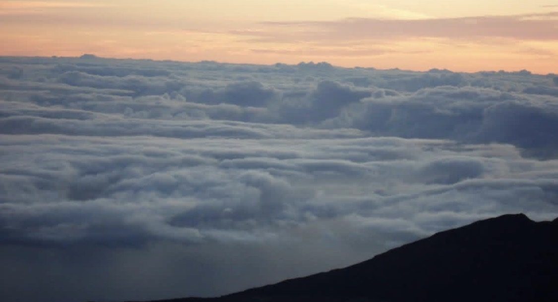 Sunrise above the clouds from the summit of Haleakala on Maui, Hawaii