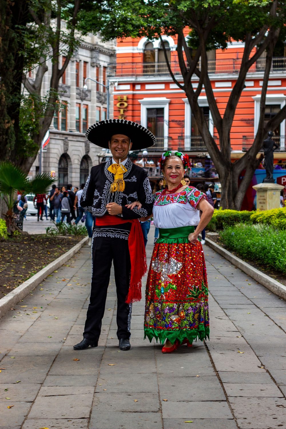 Traditional Mexican folk dancers in a colonial plaza